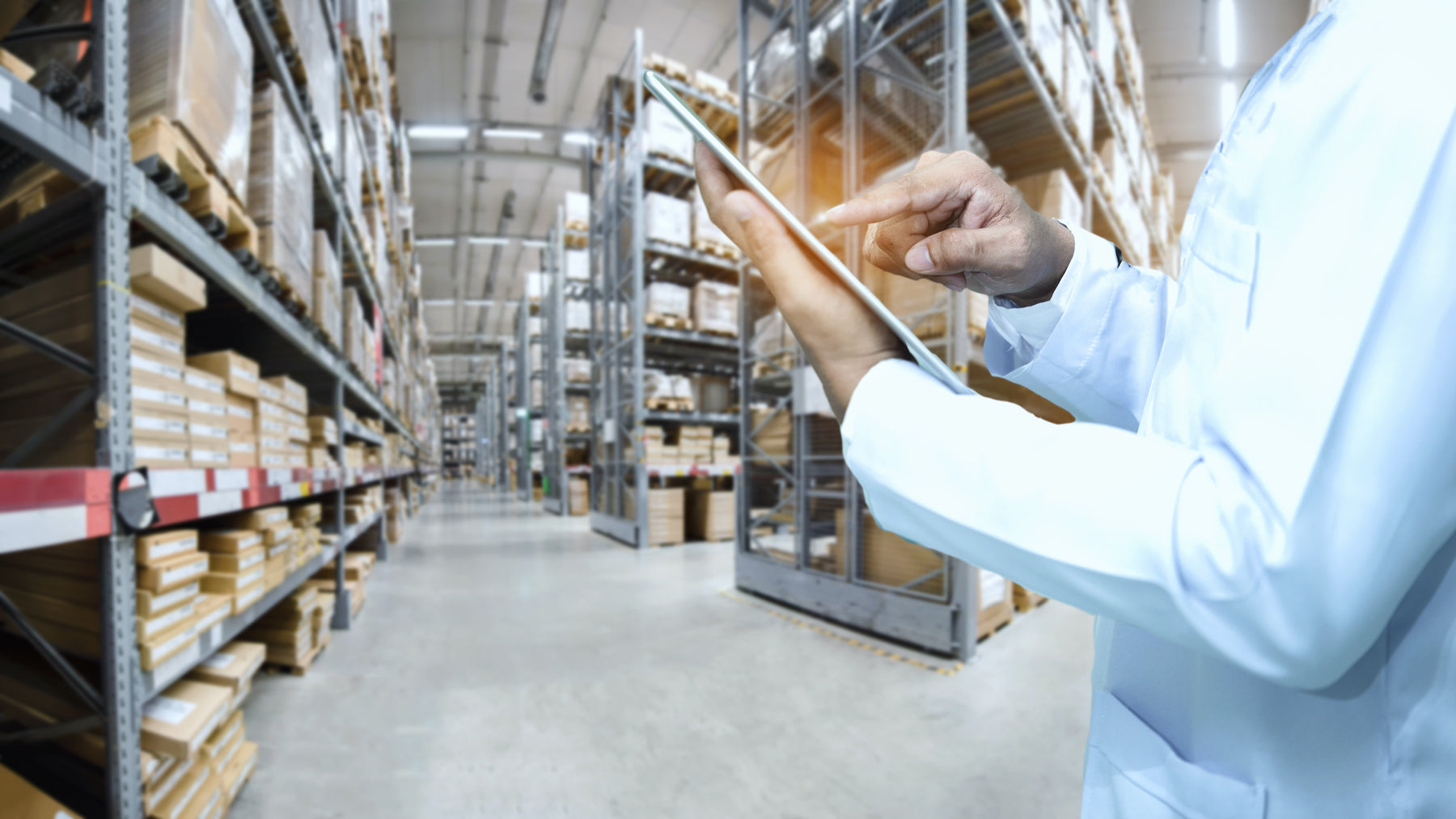 A man at a wholesale store with a tablet